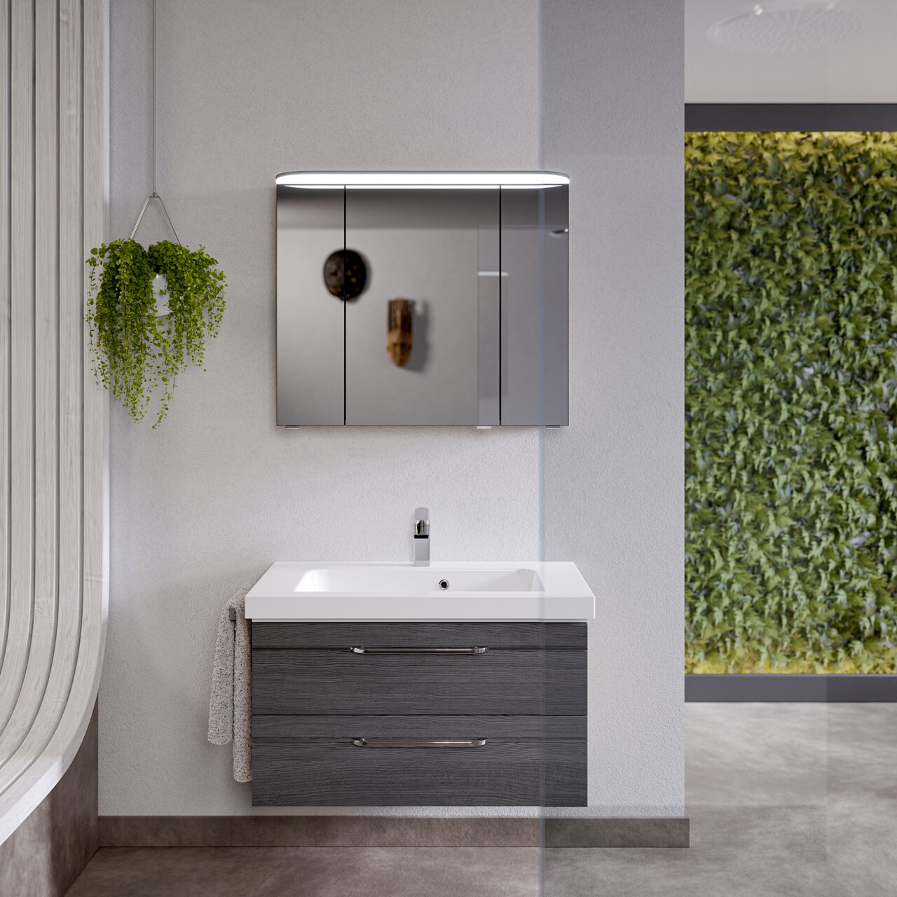 Modern badkamermeubel met spiegel en wastafel, vooraanzicht, hangplant en groene muur op de achtergrond.
