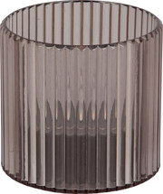 Zylindrisches, geriffeltes Glasobjekt in Nahaufnahme, frontal betrachtet.