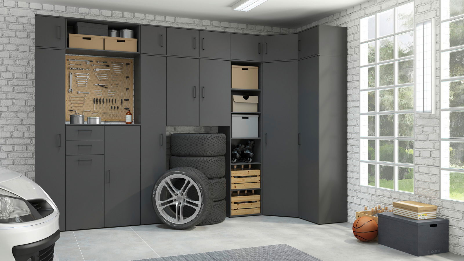 Moderne graue Garagenmöbel mit mehreren Schränken und Regalen, seitliche Perspektive.