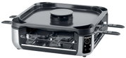 Smokeless Raclette-Grill in schräger Perspektive mit mehreren Pfännchen und digitalem Bedienfeld.