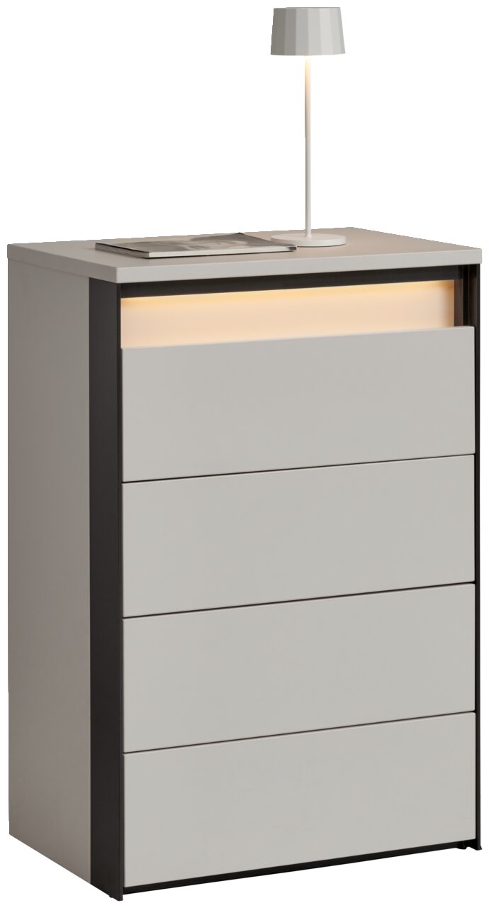 Voleo Hochkommode ZAYA Hochkommode mit vier Schubladen, moderne graue Oberfläche, seitliche schwarze Akzente, mit Tischlampe und Buch auf der Oberseite, seitliche Perspektive