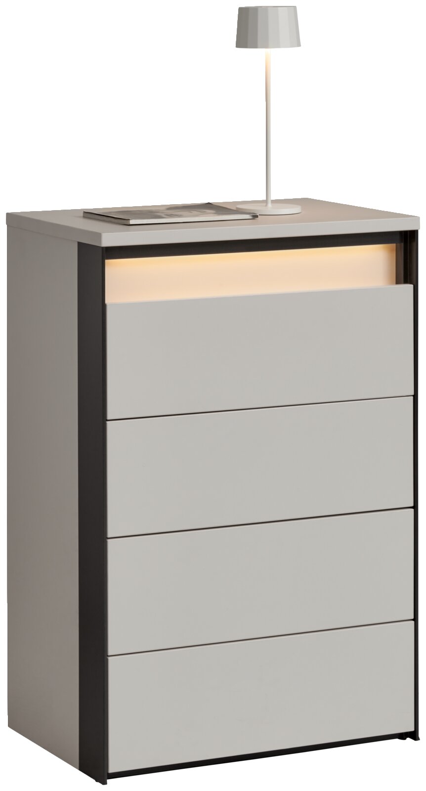 Voleo Hochkommode ZAYA Hochkommode mit vier Schubladen, moderne graue Oberfläche, seitliche schwarze Akzente, mit Tischlampe und Buch auf der Oberseite, seitliche Perspektive