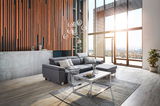 Moderne Wohnzimmeransicht mit grauem Ecksofa, Couchtisch und großen Fenstern mit Blick auf die Stadt.