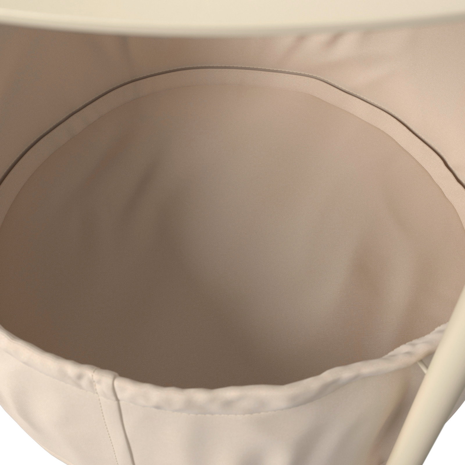 Nahaufnahme eines beigen Beistelltisches mit Stoffeinsatz von oben betrachtet.