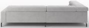 Lichtgrijze ribfluwelen modulaire bank met zwarte metalen poten, zijaanzicht (profiel) op witte achtergrond.
