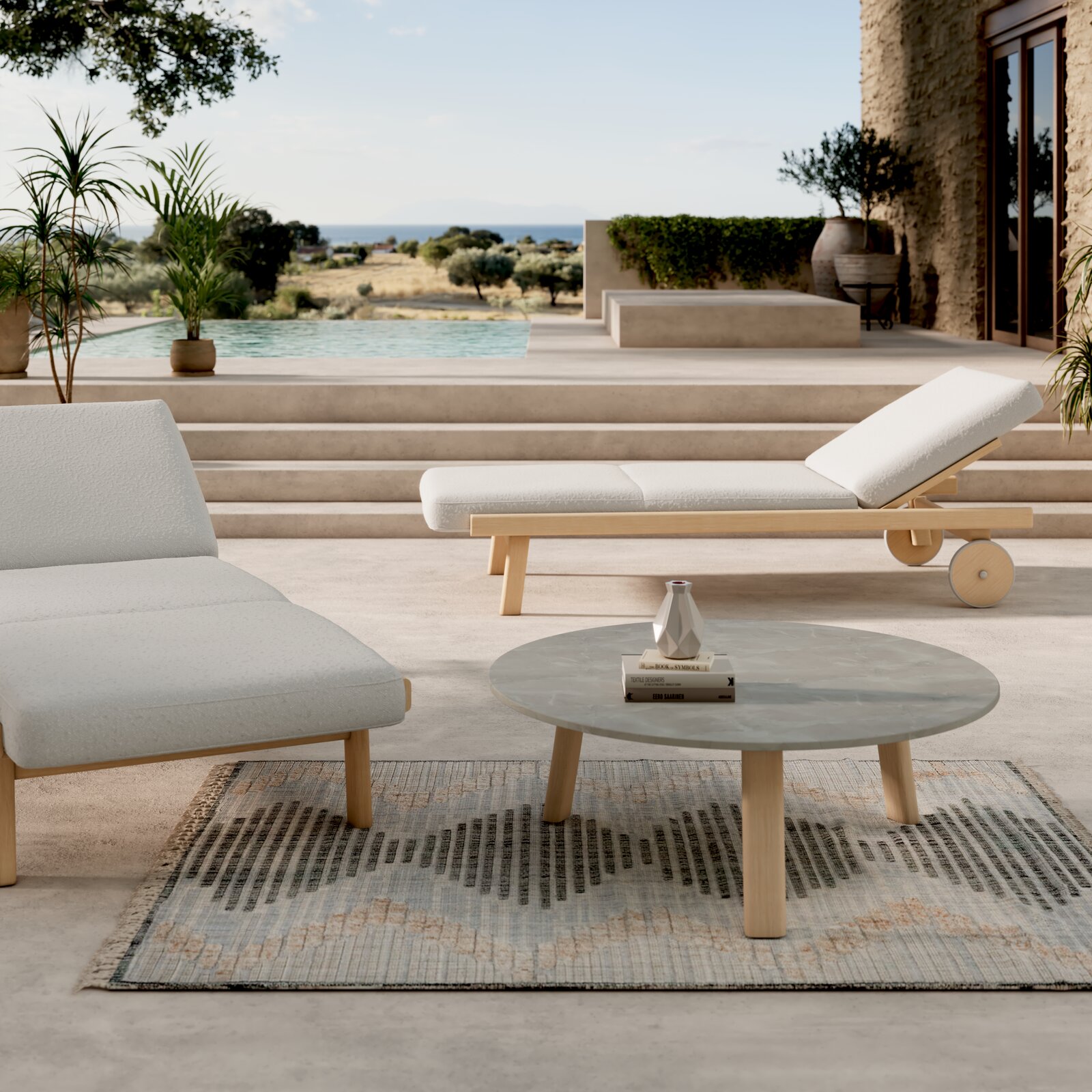 Moderne Gartenlounge mit einem runden Tisch und einer Sonnenliege in einem eleganten Außenbereich mit Pool im Hintergrund, seitliche Perspektive.