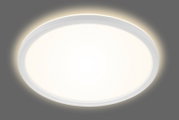 Runde LED-Deckenleuchte Briloner SLIM, Ansicht von unten, leuchtend mit sanftem Lichtschein.