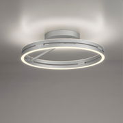 Moderne Deckenleuchte PURE Loop in silberner Farbe, seitliche Perspektive, mit kreisförmigem LED-Licht.