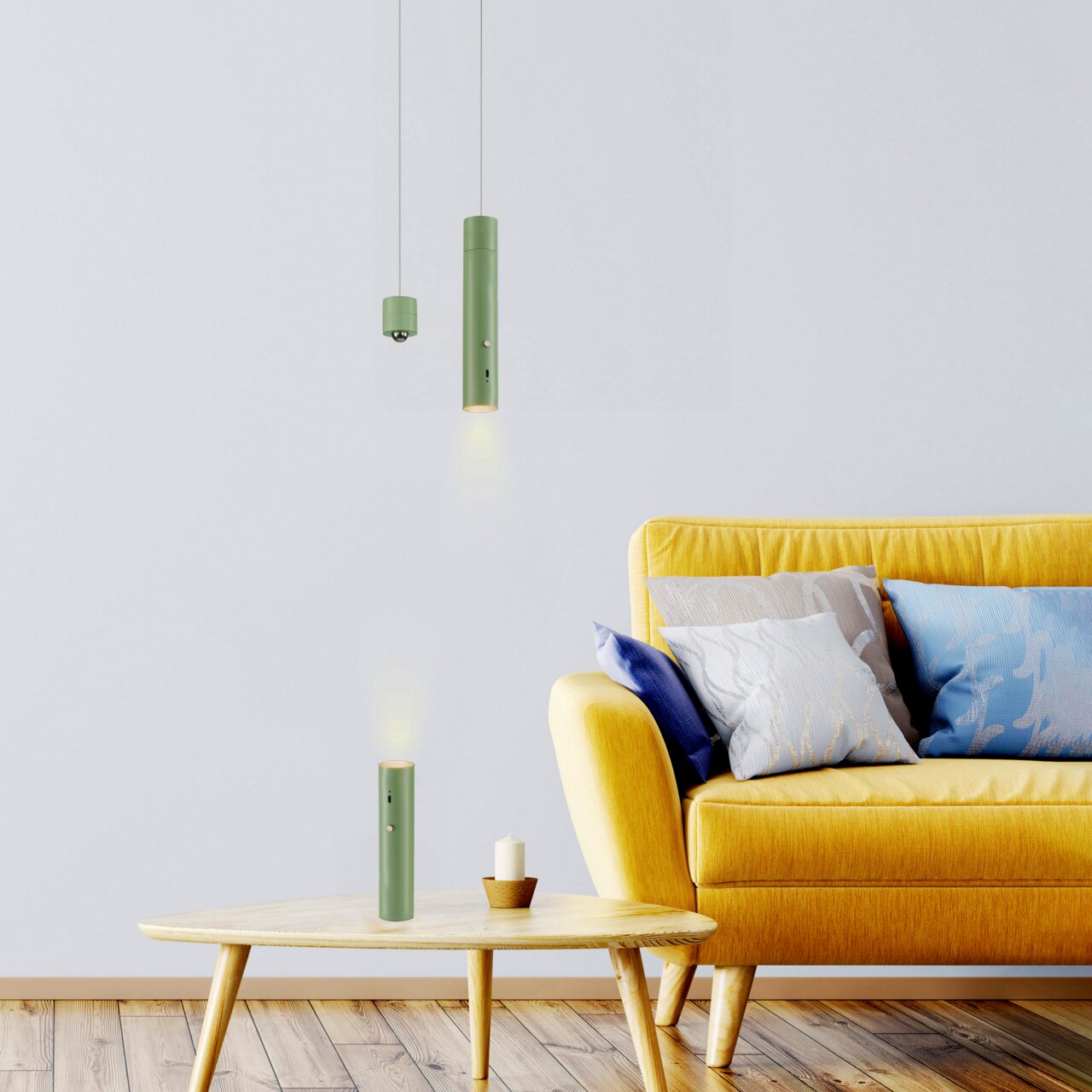 Moderne grüne Akku-Pendelleuchte in einem stilvollen Wohnzimmer mit gelbem Sofa und Holztisch, seitliche Perspektive