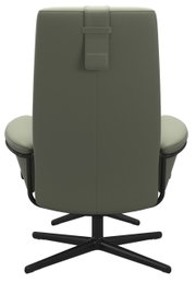 Achterkant van een moderne fauteuil in olijfgroen met een zwart draaivoet.