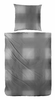 Bettwäsche-Set in Grau mit geometrischem Muster, bestehend aus einem Kissenbezug und einem Bettdeckenbezug, aus der Vogelperspektive.