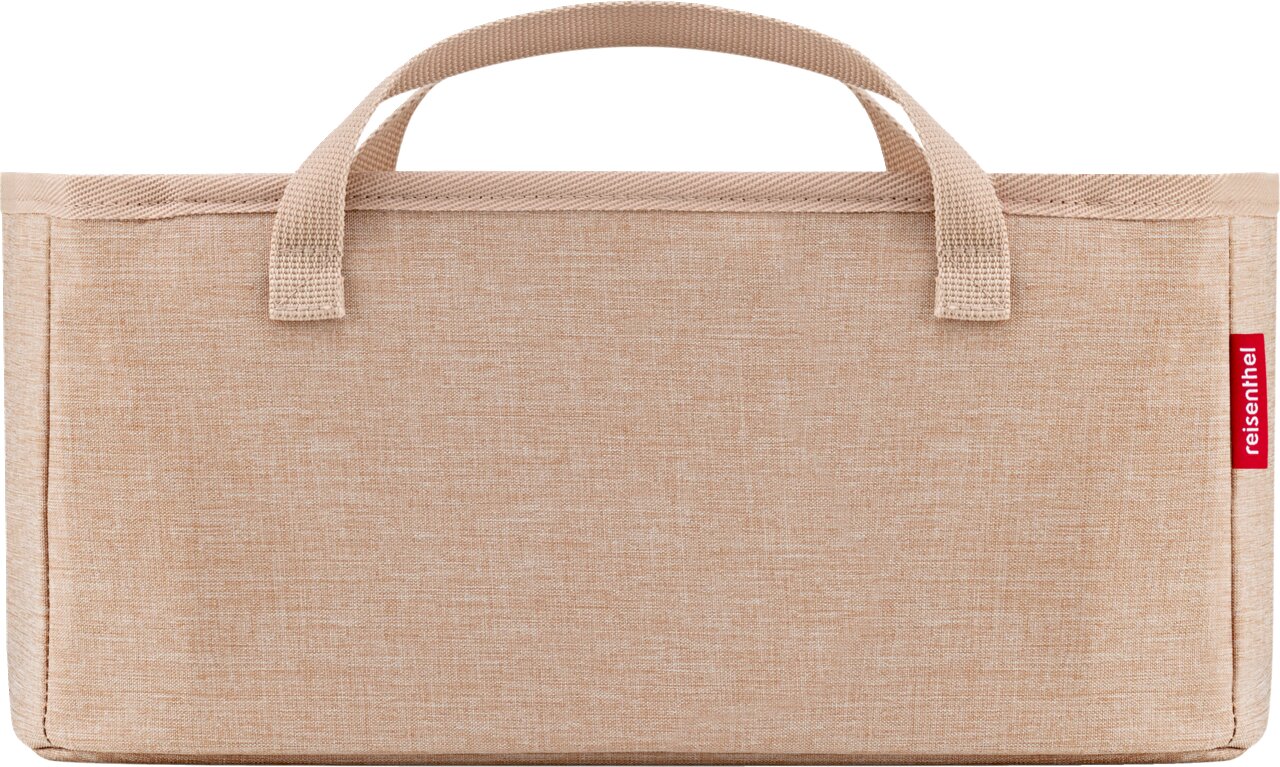 Beige opbergtas van stof met twee handvatten en een rood „reisenthel“-label, vooraanzicht tegen een witte achtergrond