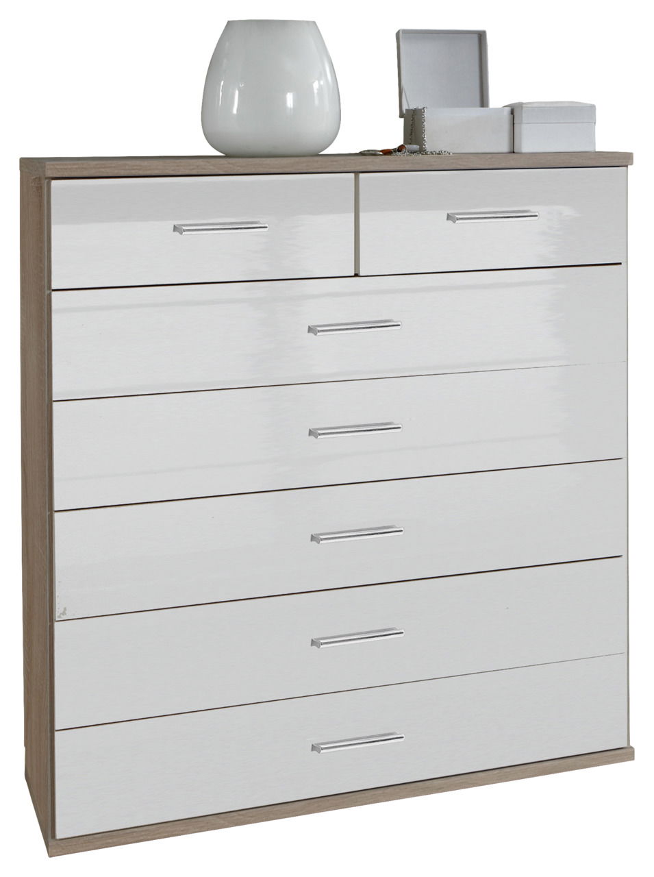 Weiße Schubkastenkommode mit mehreren Schubladen, dekoriert mit einer Vase und Schmuckkästchen, aus frontaler Perspektive.