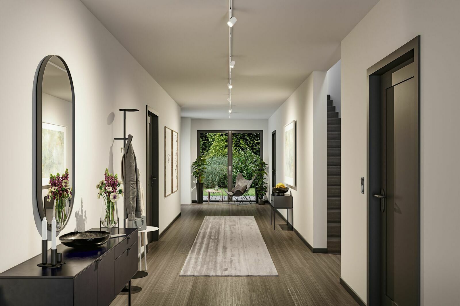 Moderner Flur mit Schienensystembeleuchtung von PAULMANN, Perspektive von der Eingangstür in Richtung Garten.