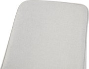 Nahaufnahme in leicht schräger Draufsicht auf eine hellbeige, rechteckige Polsterauflage mit abgerundeten Ecken und strukturierter Stoffoberfläche.