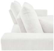 Nahaufnahme einer weißen, gerippten Sofaecke mit zwei großen Kissen, seitliche Perspektive