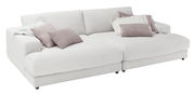 Großes, weißes Megasofa mit mehreren Kissen in verschiedenen Pastelltönen, seitliche Perspektive.