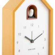 Moderner gelber Kuckuckswecker in Hausform, seitliche Perspektive