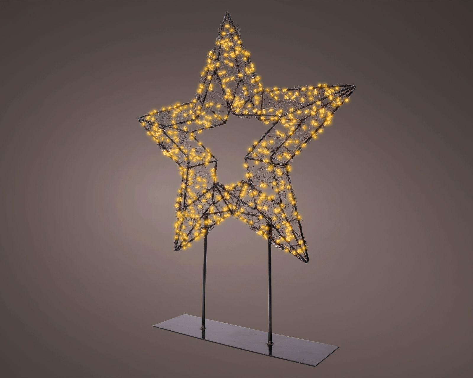 Sternförmige LED-Lampe auf einem Fuß, beleuchtet mit warmweißen Micro-LEDs, seitliche Perspektive