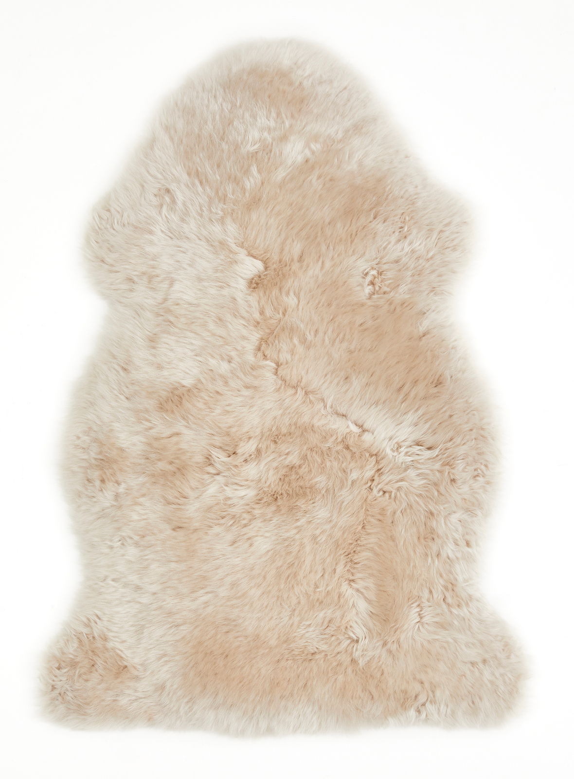 Luxor living Schaffell 85 cm FELLE Beiges Schaffell, 85 cm lang, aus der Vogelperspektive fotografiert.