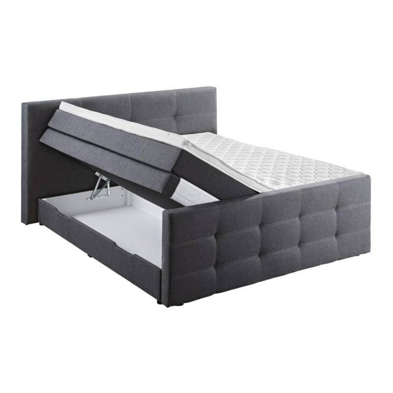 Grijs boxspringbed met opklapbaar matras en zichtbare opbergruimte, zijaanzicht