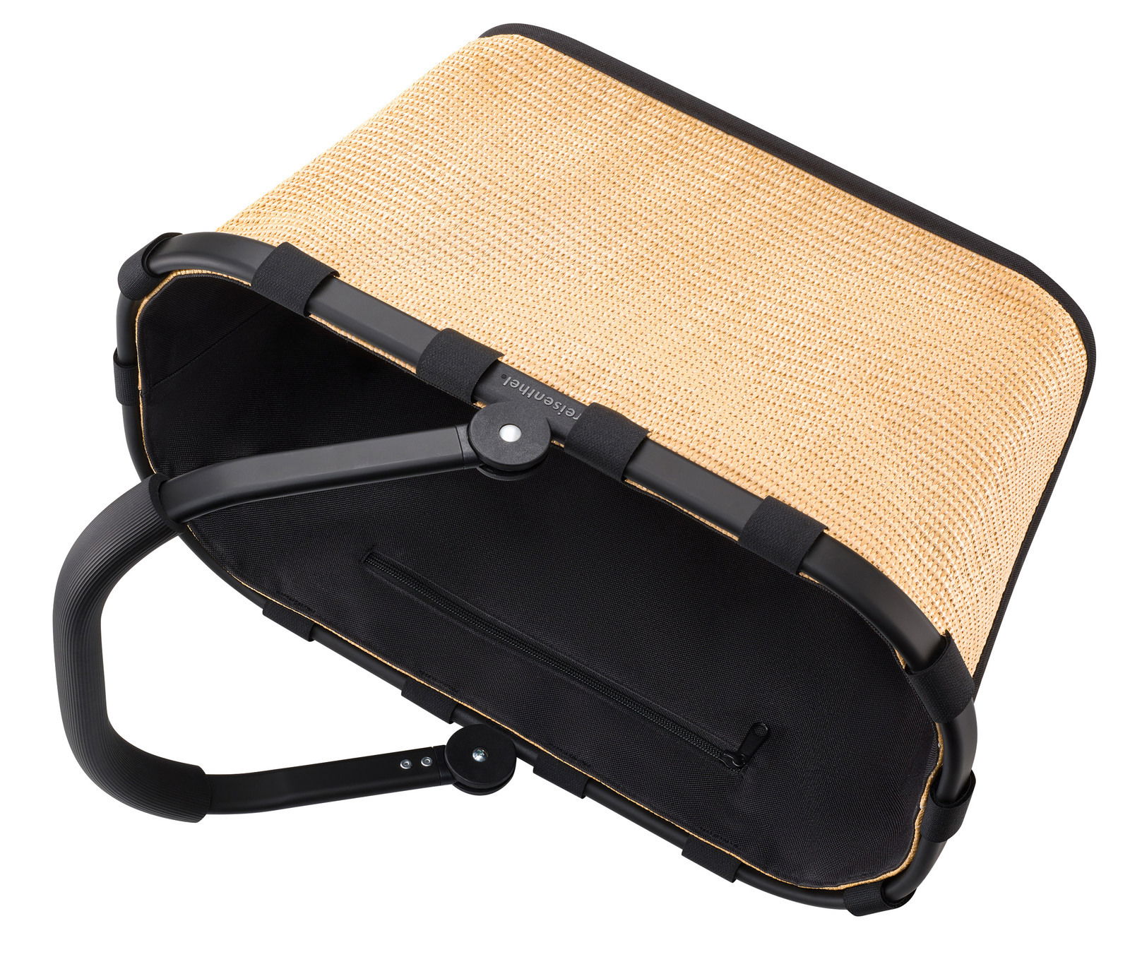 Tragetasche aus geflochtenem Material mit schwarzem Rahmen und Griff, von oben betrachtet.