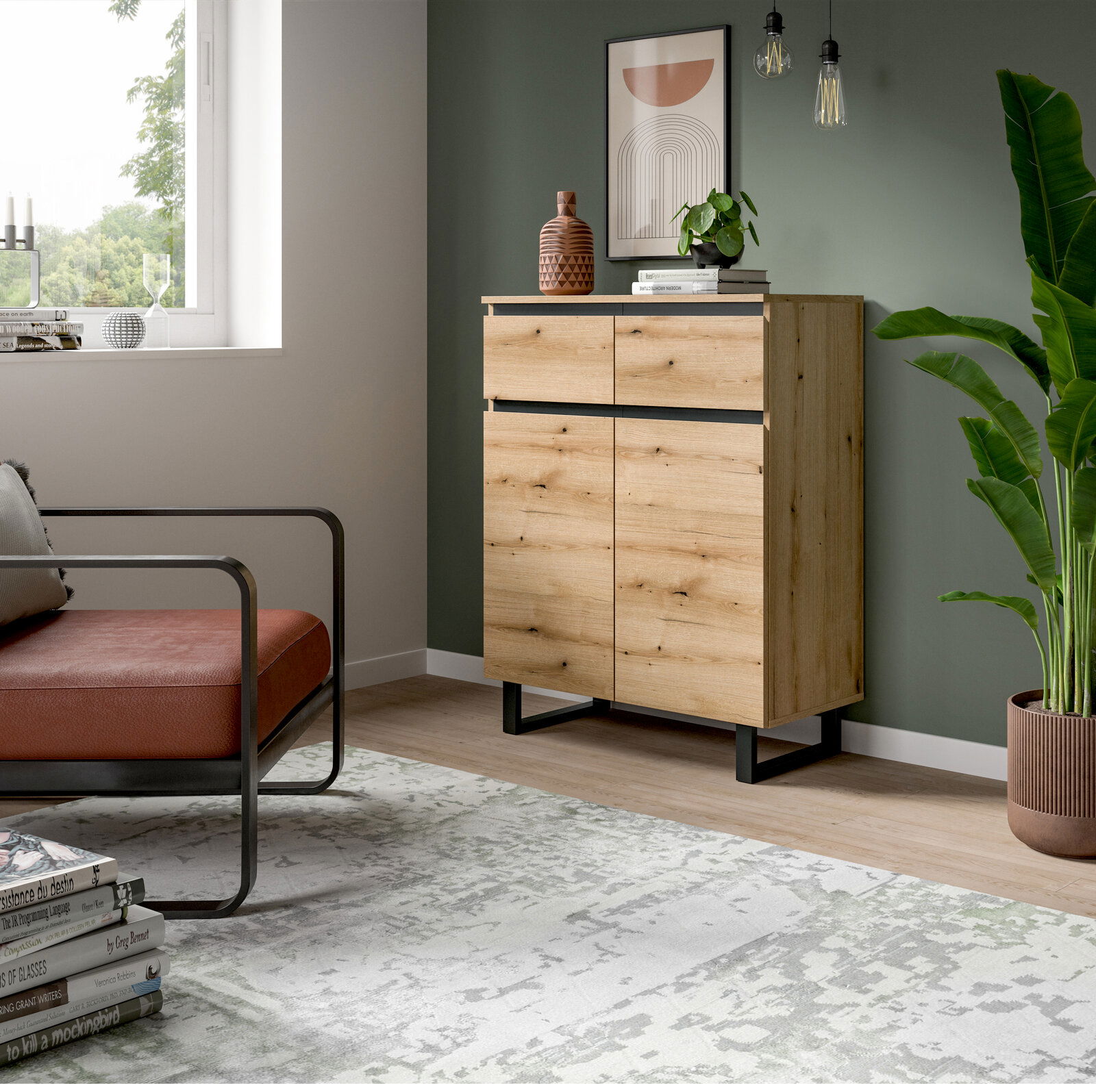 MID.YOU Kommode TOMASA Holzkommode mit zwei Schubladen und zwei Türen, in einem modernen Wohnzimmer mit grüner Wand, Pflanzen und Dekorationen, seitliche Perspektive