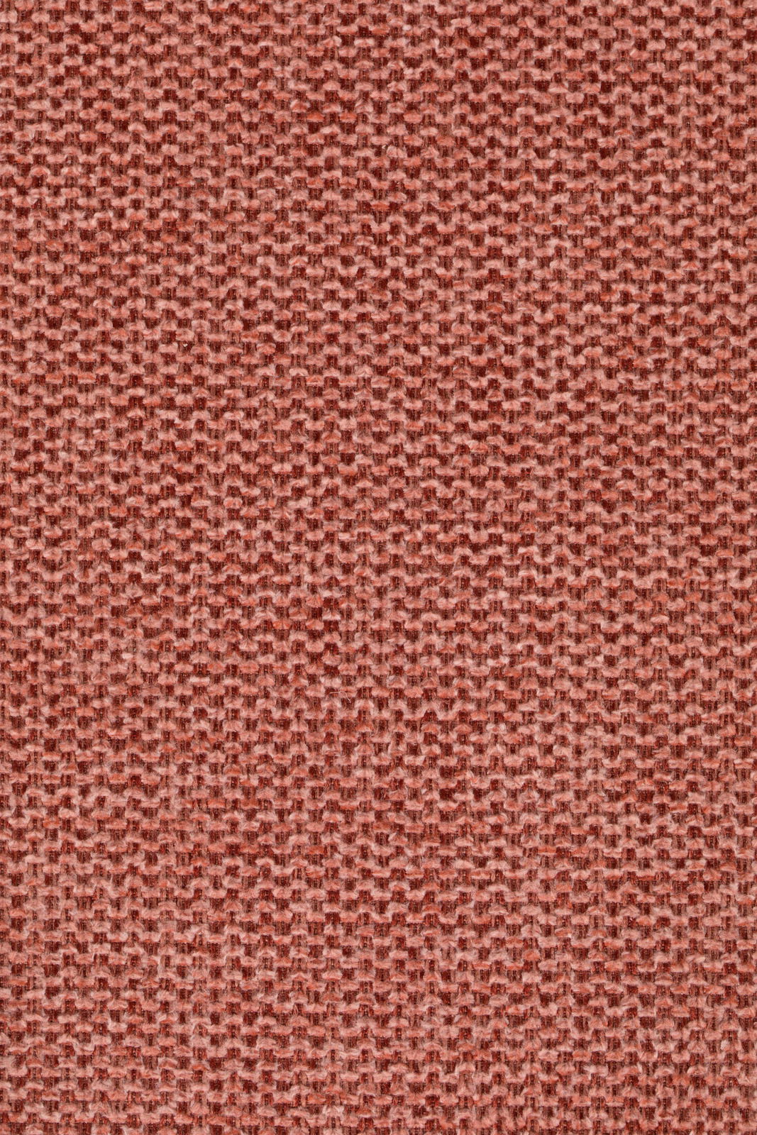 Nahaufnahme eines roten Stoffmusters mit grober Webstruktur.