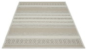 Beiger Teppich der Merinos Teppich-Serie OTTOWA mit geometrischem Muster, fotografiert aus einer leicht schrägen Perspektive.