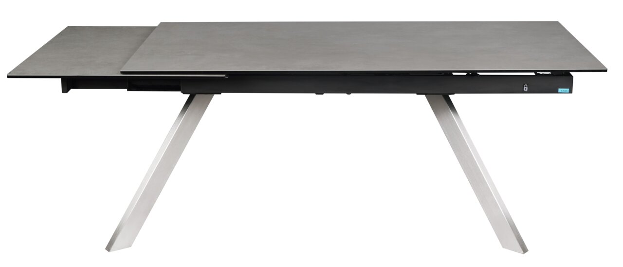 Moderner Esstisch mit grauer Tischplatte und schrägen Metallbeinen, seitliche Perspektive