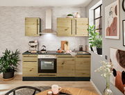 Moderne Küchenzeile in Holzoptik mit Herd, Dunstabzugshaube und Spüle, umgeben von Pflanzen und Dekorationen, aus der Perspektive eines gemütlichen Wohnraums.