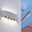 Silberne LED-Wandleuchte mit modernem Design, seitliche Perspektive, die Lichtstrahlen nach oben und unten wirft.