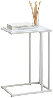 Moderner weißer Beistelltisch mit Metallgestell, darauf Bücher und ein Glas mit Brotstangen, seitliche Perspektive.