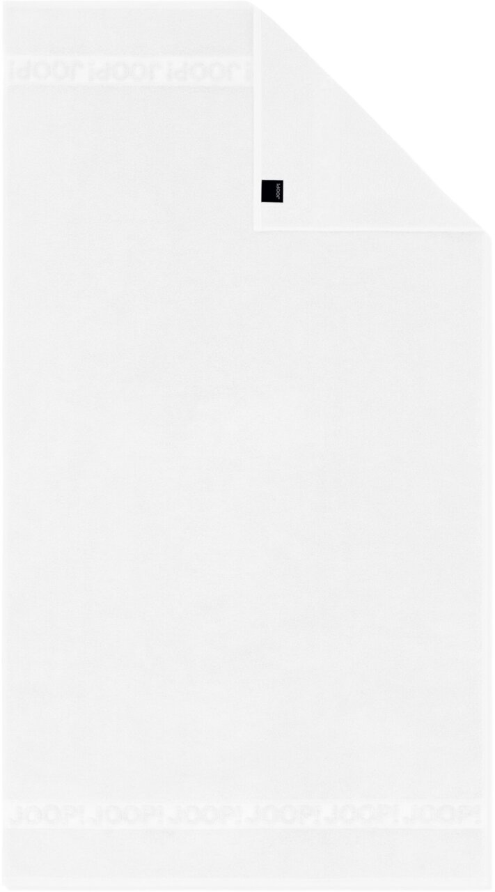 Witte Joop!-handdoek met ingeweven logo-rand, plat uitgespreid in bovenaanzicht, hoek omgeslagen met merklabel
