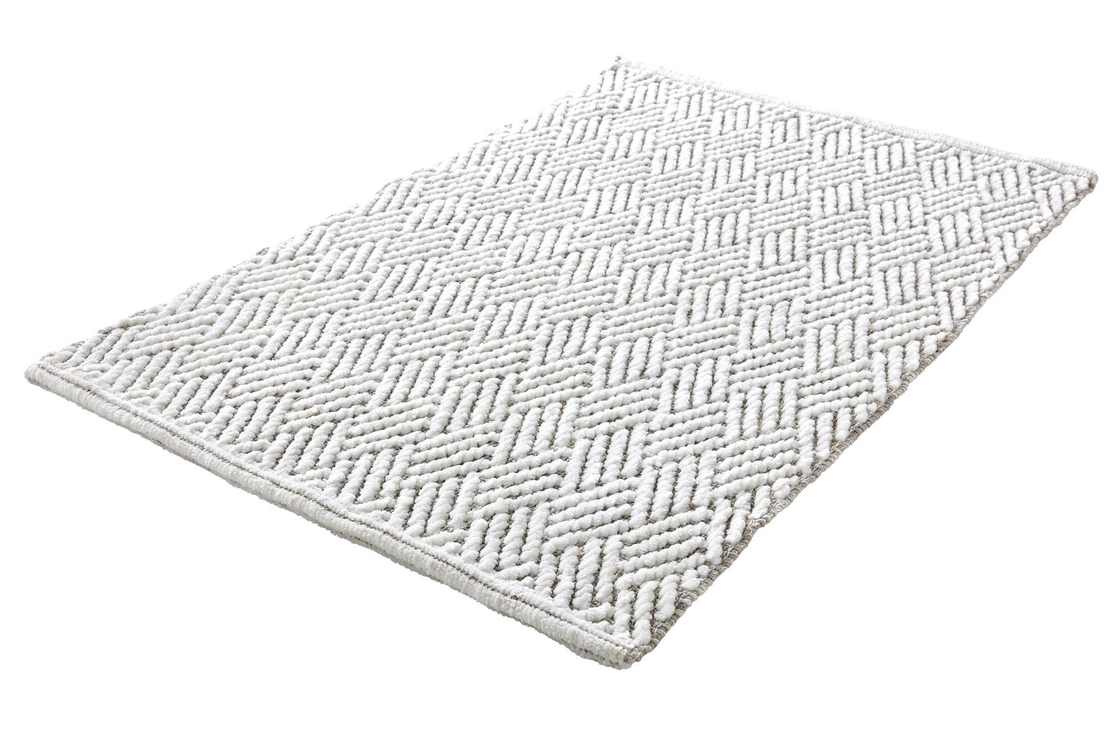 Kleine Wolke Badteppich SWITCH Weißer Badteppich mit geometrischem Muster, perspektivisch von der Seite fotografiert.