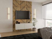 Modern hangend tv-meubel in een stijlvolle woonkamer, gezien vanaf de voorkant, met wandverlichting en decoratieve elementen.