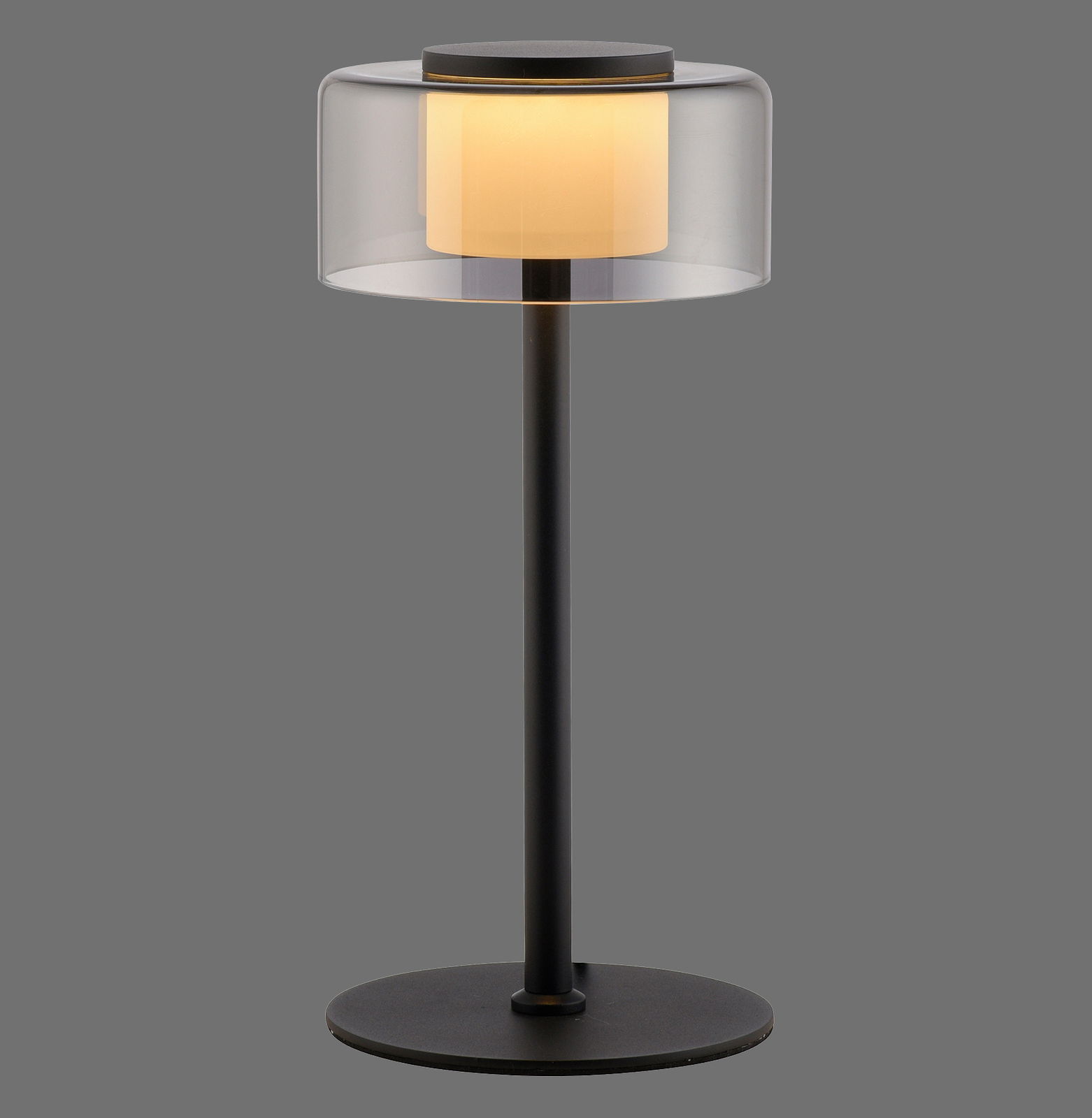 Moderne Tischleuchte RIKA mit schwarzem Standfuß und transparentem Lampenschirm, seitliche Perspektive