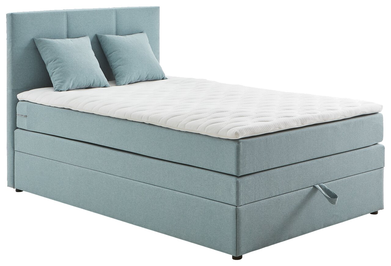 Boxspringbett in hellblauem Stoffbezug mit zwei Kissen, seitliche Perspektive