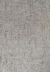 Nahaufnahme eines beige-gemusterten Stoffes, möglicherweise Polsterung für den Armlehnstuhl Dieter Knoll Armlehnstuhl PABLO.