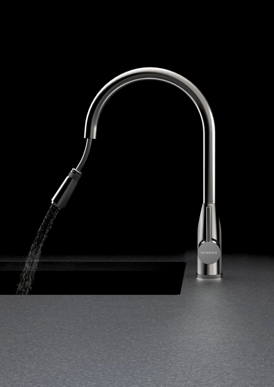 Zurbrüggen Einhebelmischer KAVUS Moderner Einhebelmischer aus Edelstahl mit gebogenem Auslauf, seitlicher Perspektive, Wasser fließt in ein Waschbecken.