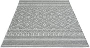Grijze loper met een geometrisch ruit- en randpatroon, van bovenaf gefotografeerd vanuit een schuin perspectief
