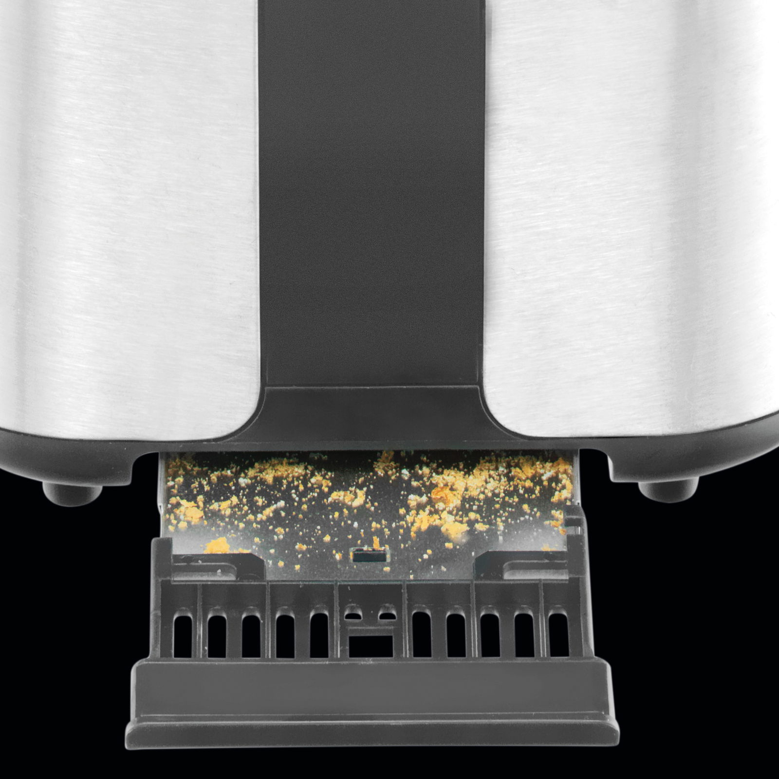 Nahaufnahme eines Toasters mit herausziehbarer Krümelschublade, Ansicht von unten.