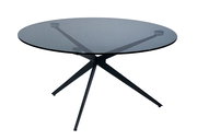 Runder Couchtisch mit Glasplatte und modernem Metallgestell, seitliche Perspektive