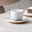 Villeroy & Boch Untertasse AFINA Weiße Kaffeeuntertasse Afina 14,2cm mit Tasse und Löffel, seitliche Perspektive