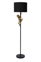 Stehlampe mit schwarzem Lampenschirm und goldener Affenfigur, die am Ständer hochklettert, seitliche Perspektive
