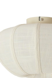Frontale Nahaufnahme eines cremeweißen, strukturierten Bustier-Tops in Leinenoptik auf einer Schneiderpuppe, mit geformten Cups und sichtbaren Teilungsnähten