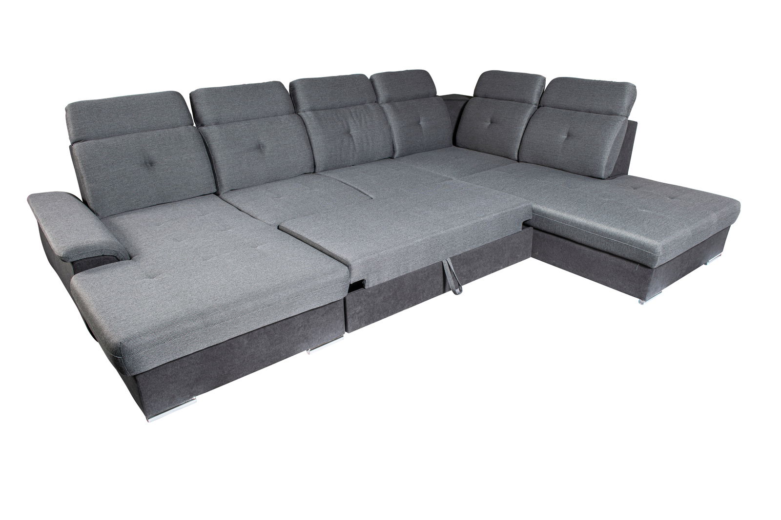 Graues Ecksofa in U-Form mit verstellbaren Rückenlehnen, aus der Vogelperspektive fotografiert.