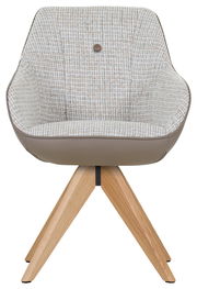 Vorderansicht eines modernen Armlehnstuhls mit gemustertem Stoffbezug und Holzbeinen.