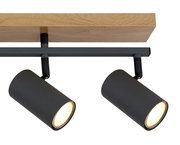 Zwei schwarze Strahler an einer Holzhalterung, seitliche Perspektive