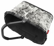 Carrybag mit schwarzem Rahmen und Griff, dekoriert mit einem schwarz-weißen Landschaftsmuster, aus der Perspektive von oben seitlich betrachtet.